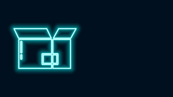 Glowing neon line Carton cardboard box icon isolated on black background. Box, package, parcel sign. Delivery and packaging. 4K Video motion graphic animation - Footage, Video