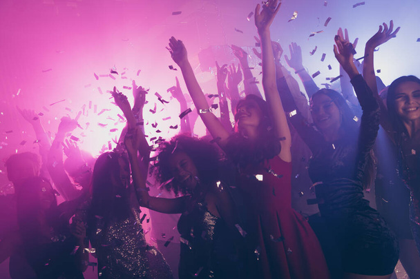 Photo of big group many classy girls falling confetti catch arms neon bright pink spotlight modern club indoors - Photo, Image
