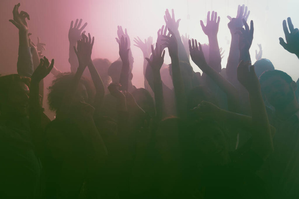 Photo of big company crazy people rise hands neon spotlight wear stylish trendy outfit modern club indoors - Valokuva, kuva