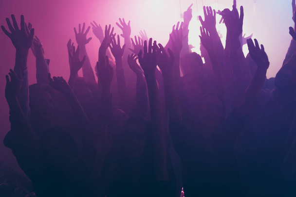Photo of big group funky people rise arms neon spotlight wear stylish trendy outfit modern club indoors - Φωτογραφία, εικόνα
