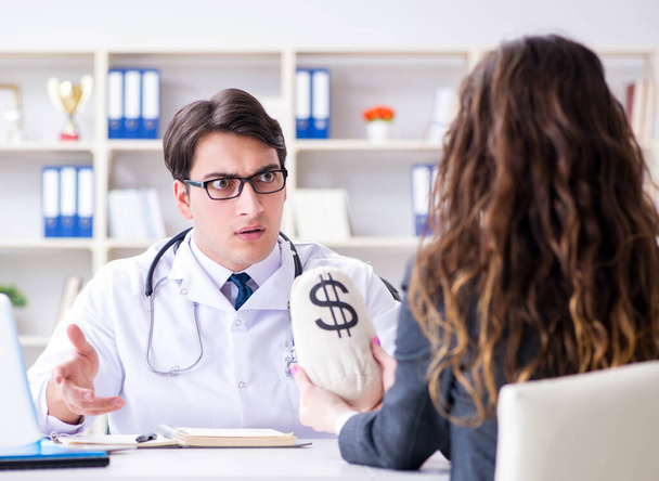 Young doctor in medical insurance fraud concept - Foto, imagen