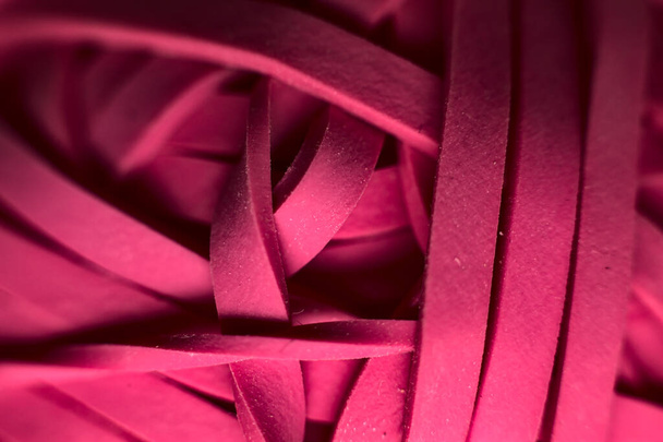 Closeup of a group of pink rubber bands - Foto, afbeelding