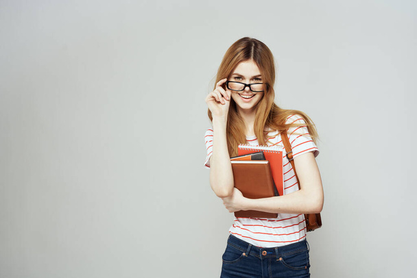 female student with notepad and backpack on back cropped view education science glasses - Fotografie, Obrázek