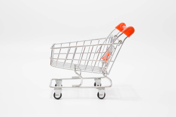 Empty Shopping cart on white background for online shopping concept - Фото, зображення