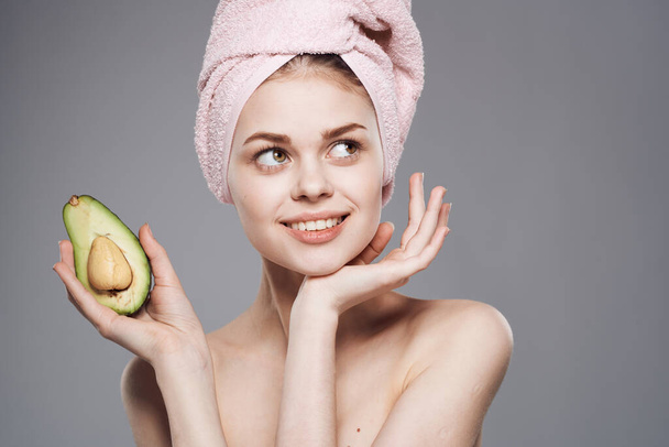 Pretty woman clean skin avocado in hand health cosmetics procedure - Photo, Image