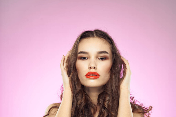 Woman with hairstyle and red lips naked shoulders bright makeup attractive look - 写真・画像