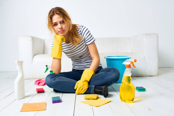 Tired woman housewife cleaning detergent lifestyle room - Photo, Image