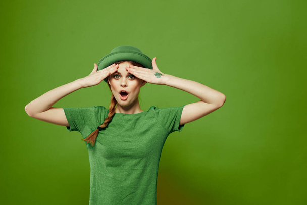 st patricks day happy woman gesturing with her hands hat shamrock holidays fun - 写真・画像