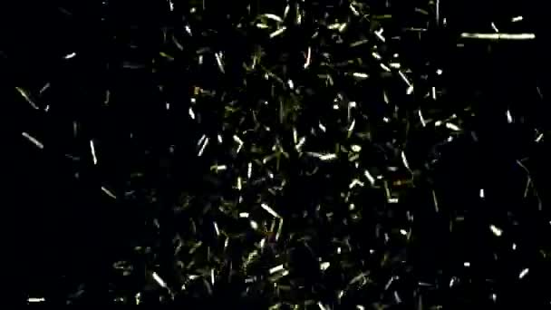 Ensemble de bonbons de Noël festifs volant dans des confettis dorés au ralenti - Séquence, vidéo