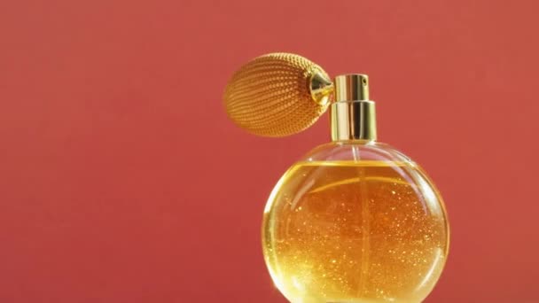 Golden perfume bottle and shining light flares, chic fragrance scent as luxury product for cosmetic and beauty brand  - Footage, Video