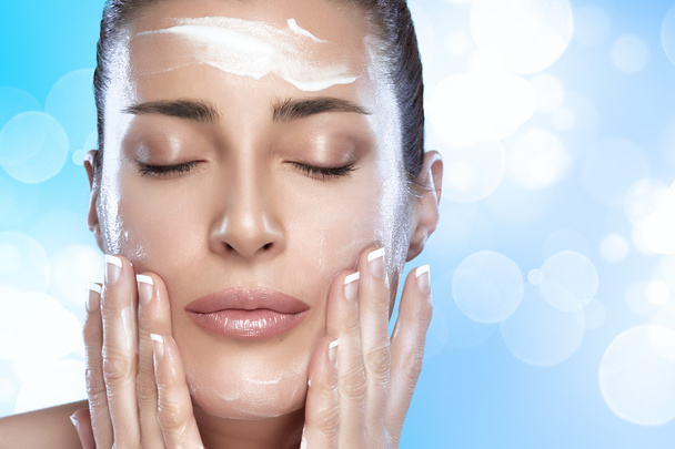Beautiful Spa Girl with Cream on Her Face. Skincare concept - Φωτογραφία, εικόνα