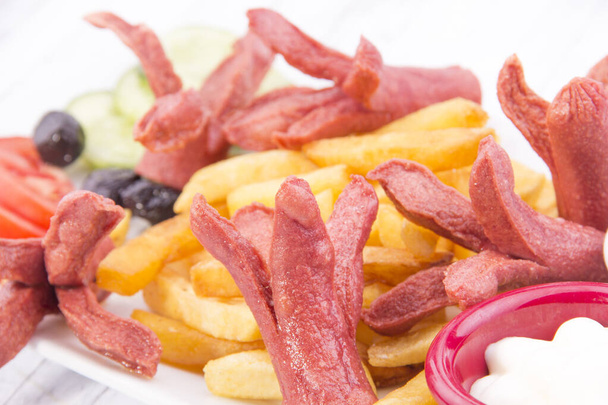 sausages with chips close up - Photo, Image