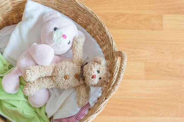 A couple of teddy bear in a basket for washing  - Foto, imagen