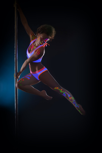Image of sexy pole dancer posing in jump - Fotografie, Obrázek