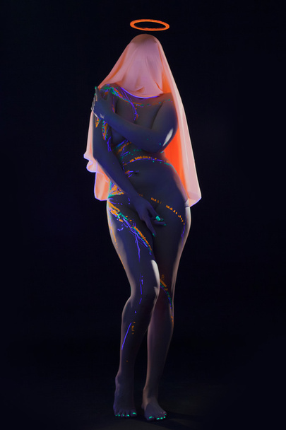 Oracular girl with UV luminous pattern on body - Foto, Imagem