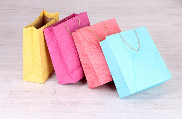 Colorful shopping bags,  on light background - Φωτογραφία, εικόνα