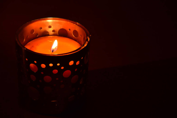 burning candle on a black background. flame of fire - Foto, immagini