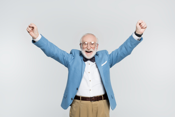 Cheerful senior man showing yeah gesture isolated on grey  - Zdjęcie, obraz