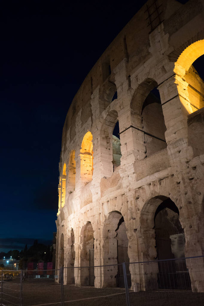 Night at the Great Roman Colosseum (Coliseum, Colosseo), also known as the Flavian Amphitheatre with lights & illumination. - Photo, Image