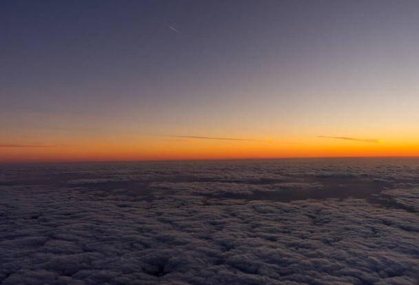 Netherlands, a sunset over a body of clouds - Photo, Image