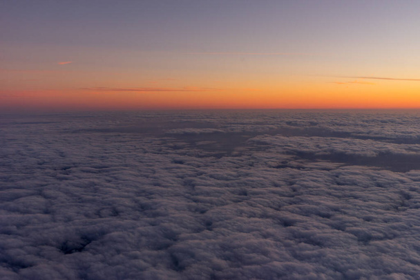Netherlands, a sunset over a body of clouds - Photo, Image