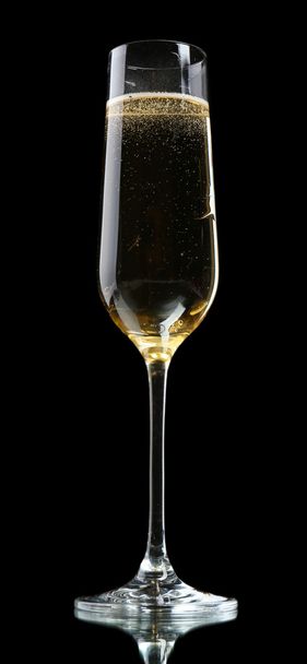 Glass of champagne, on black background - Фото, изображение