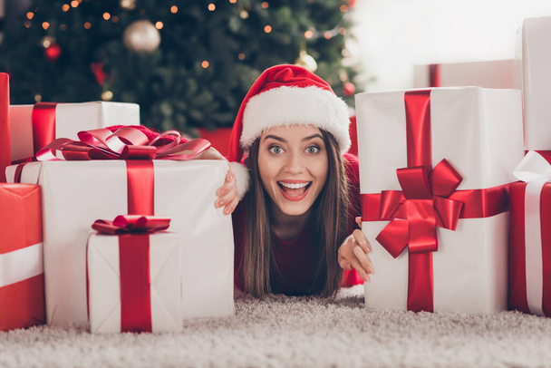 Close-up portrait of her she nice attractive lovely charming glad cheerful cheery girl lying on carpet floor among pile stack many giftboxes December sale in light house interior indoor - Fotó, kép