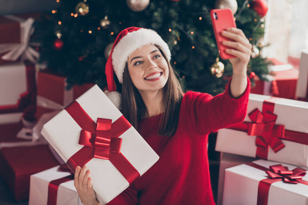 Portrait of her she nice attractive pretty cheerful cheery girl holding in hand giftbox taking making selfie Eve Noel having fun blogging in decorated house apartment indoor - Φωτογραφία, εικόνα