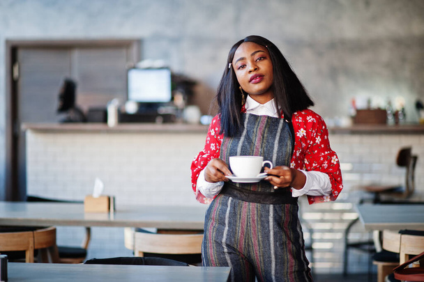 Confident young african american woman in smart casual wear at cafe.  - Foto, Bild