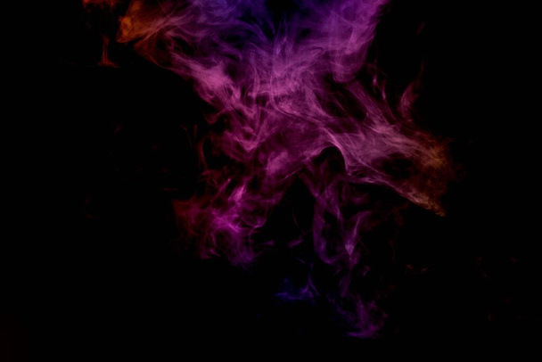 Abstract smoke isolated on black background,Rainbow powder - Photo, Image