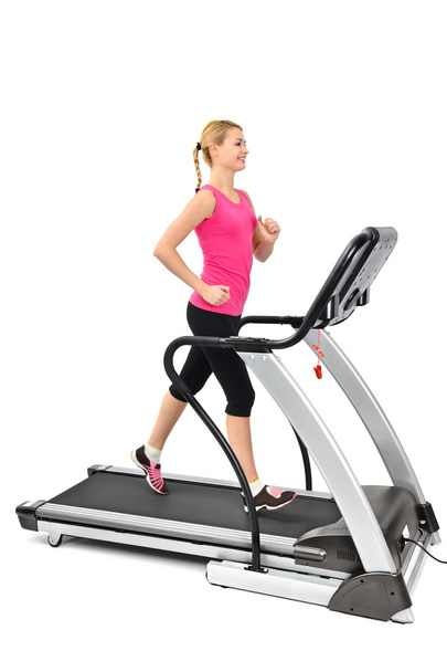 young woman doing exercises on treadmill - Photo, Image