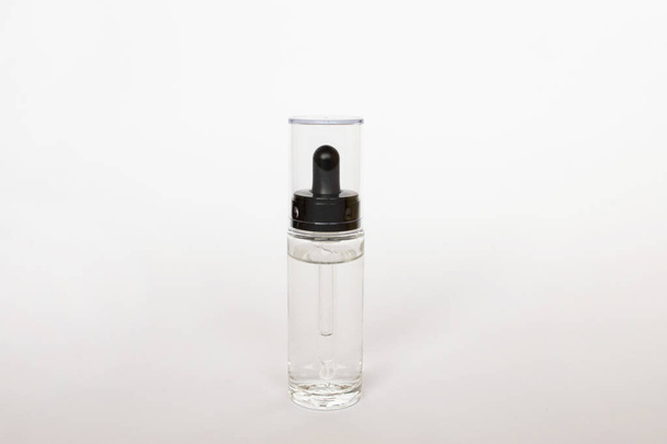 Dropper glass Bottle Mock-Up. osmetic pipette on white background - Fotó, kép