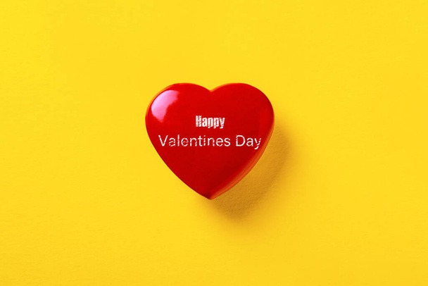 Happy Valentines Day inscription over red heart, love concept - 写真・画像