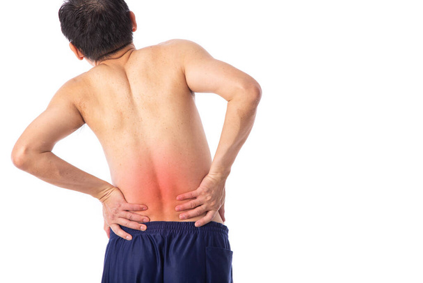 腰痛や背骨の痛みが痛い。捻挫や関節炎の症状.中年の男は白い背景の上に腰を下げて. - 写真・画像