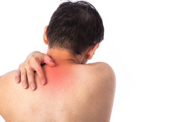Sore pain of shoulder. Sprain and arthritis symptoms. middle age man holding his hurt shoulder over white background. - Photo, image
