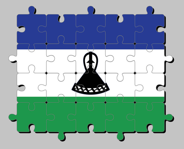 Puzzle della bandiera del Lesotho in blu bianco e verde con un mokorotlo nero (un cappello Basotho). Concetto di compimento o perfezione. - Vettoriali, immagini