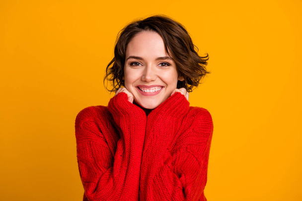 Photo of overjoyed lady good mood enjoy joyful soft cloth laundry warmth toothy smile winter holidays atmosphere wear casual red knitted sweater isolated vivid yellow color background - Fotoğraf, Görsel