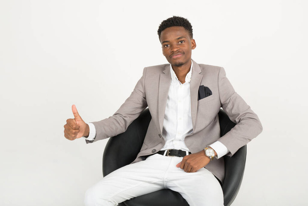 handsome young african male in suit with hand gesture - Foto, Imagen