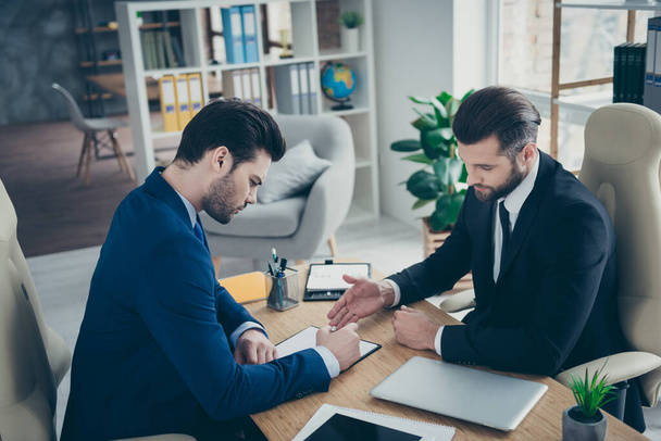 Portrait of two nice attractive handsome classy elegant trendy men economist signing employment contract offer recruiting in light white interior work place station indoors - Photo, Image
