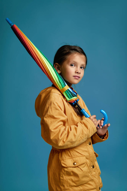 cute child girl with multicolored umbrella - Foto, imagen