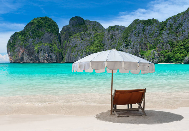 Blue sea island beach and relax chair with umbrella. - Photo, Image