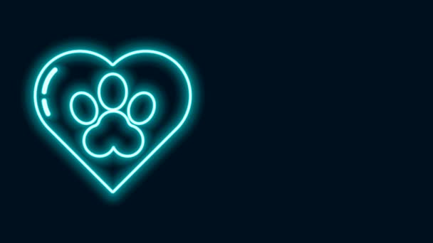 Glowing neon line Heart with animals footprint icon isolated on black background. Pet paw in heart. Love to the animals. 4K Video motion graphic animation - Footage, Video