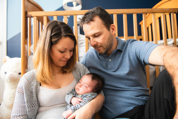 The Parents Sitting In Nursery With Baby son - Photo, Image