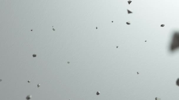 Tausende herabfallende Steinbrocken auf einer glatten weißen Oberfläche. Abstrakter Hintergrund. Ansicht von oben - Filmmaterial, Video