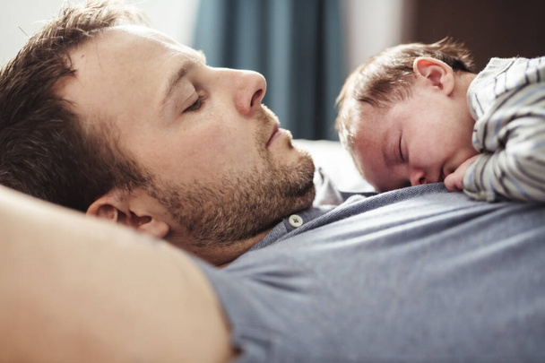 Father and Baby having wonderful time on bed on the morning - Foto, Bild