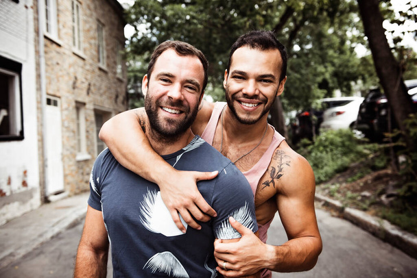 A Portrait of a happy gay couple outdoors in urban background - Fotoğraf, Görsel