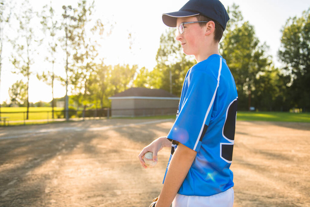 A children baseball players standing on the playground - Фото, изображение