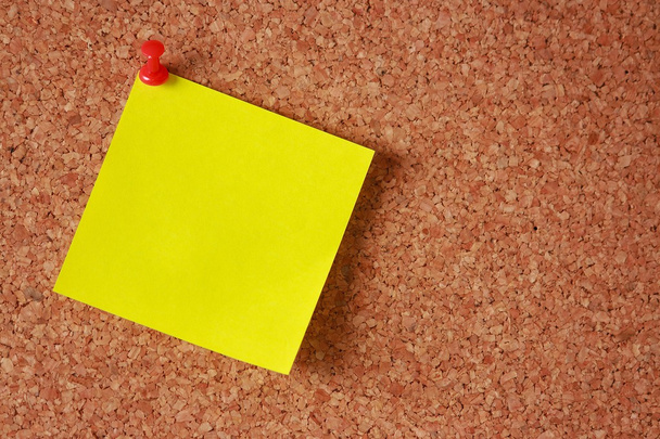 Yellow sticky note on a board - Fotografie, Obrázek