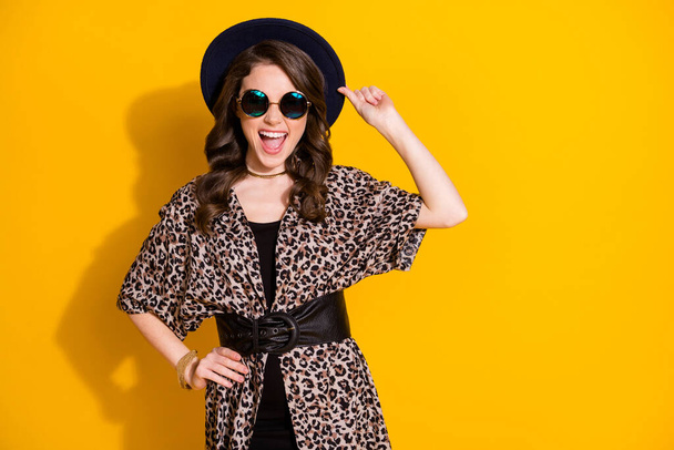 Photo of candid satisfied crazy girl enjoy rejoice summer free time touch her hat wear good look retro outfit isolated over vivid color background - Fotografie, Obrázek