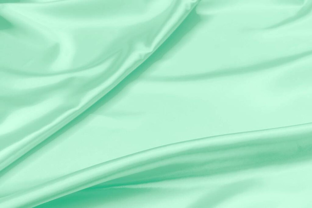 green satin fabric texture soft blur background - Photo, Image